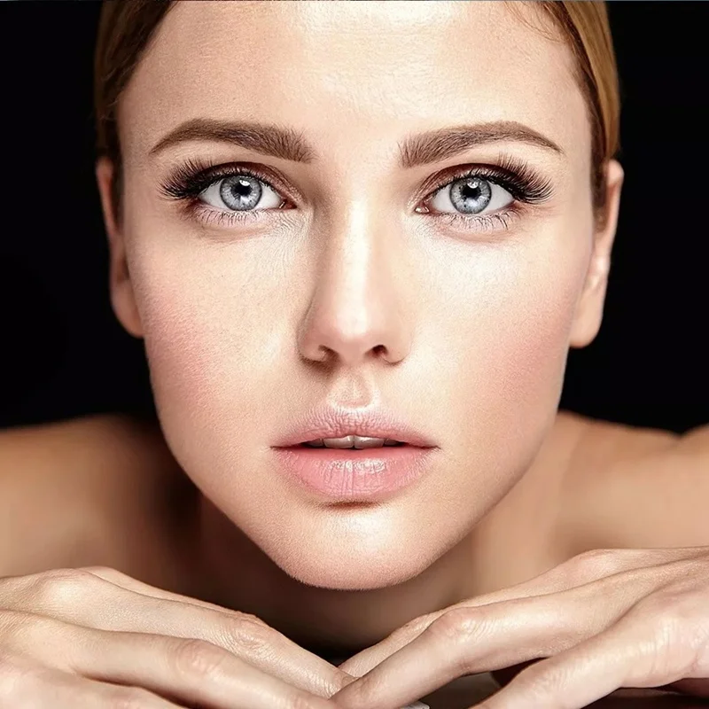 Close-up profile of a woman's flawless skin texture showcasing cellular regeneration from a nanofat transfer procedure.