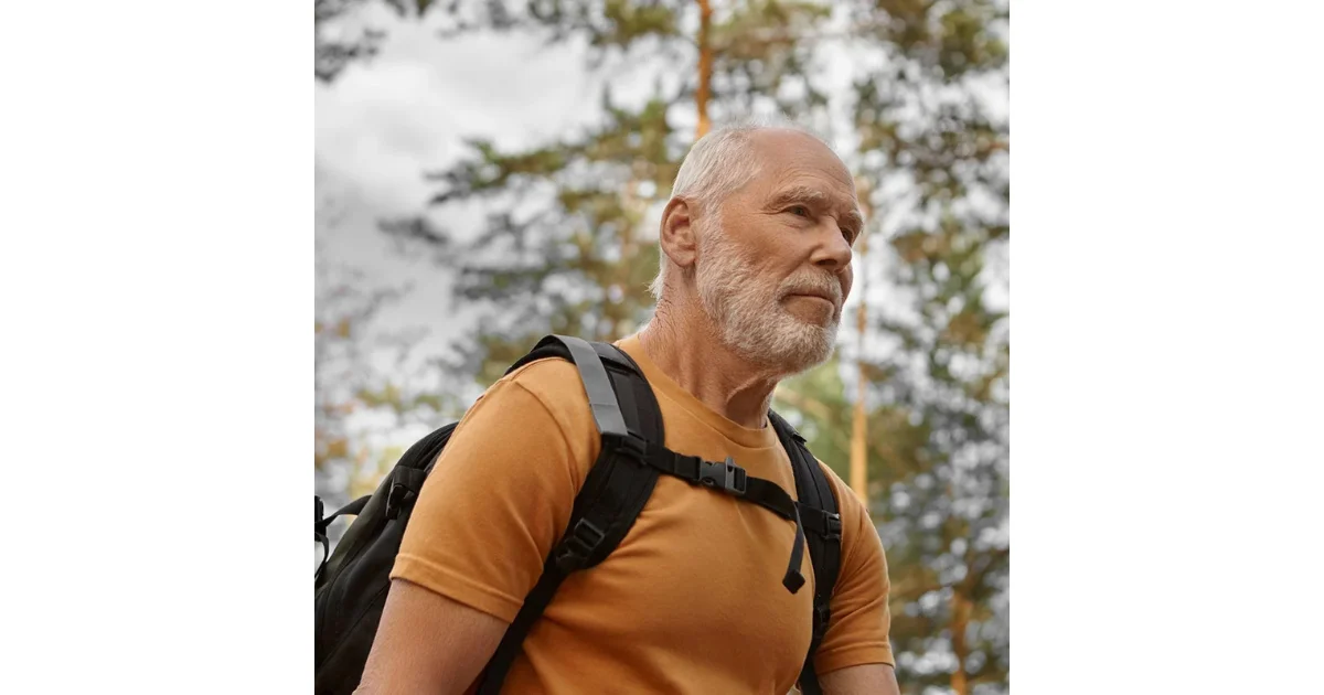 Senior man looking confidently out toward the ocean, emphasizing restored drive and vitality from low testosterone and male hormone replacement therapy.