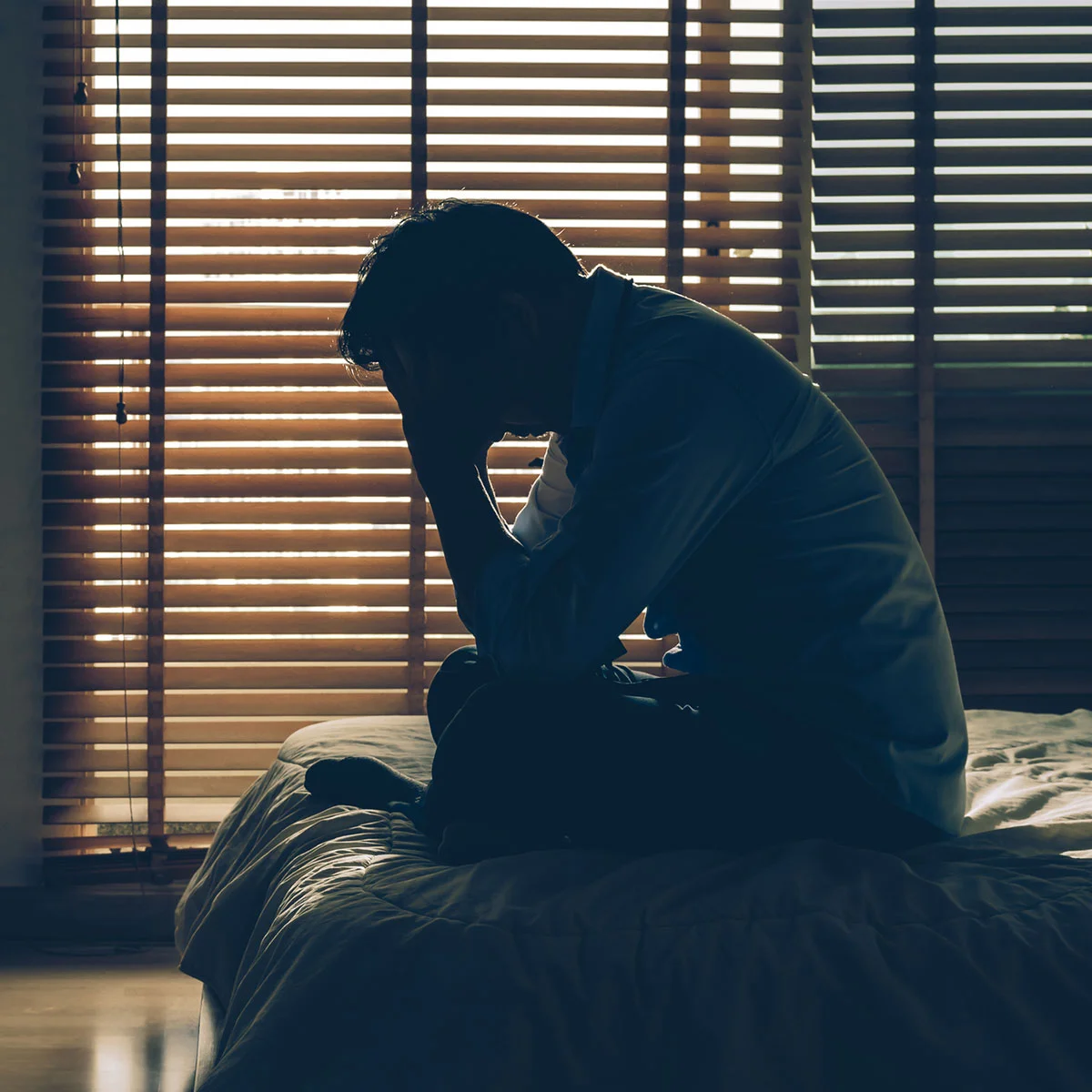 Shadow silhouette of a man, representing restored confidence following a surgical or non-surgical gynecomastia treatment.